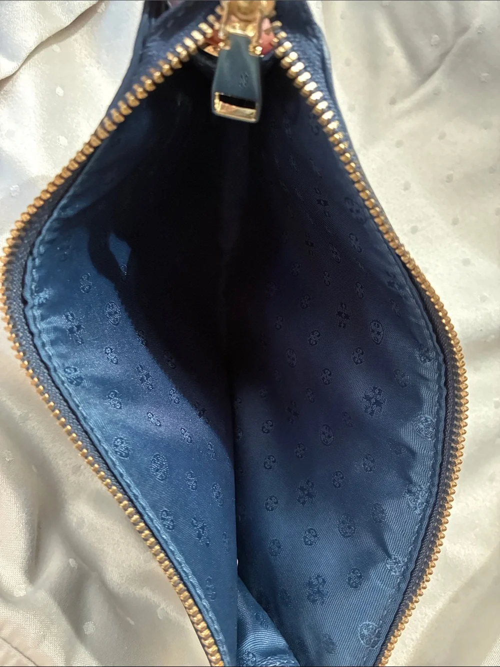 Fair condition Tory Burch Dark Navy Leather Zip pouch with Gold Logo